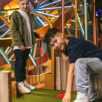 2 boys playing crazy golf